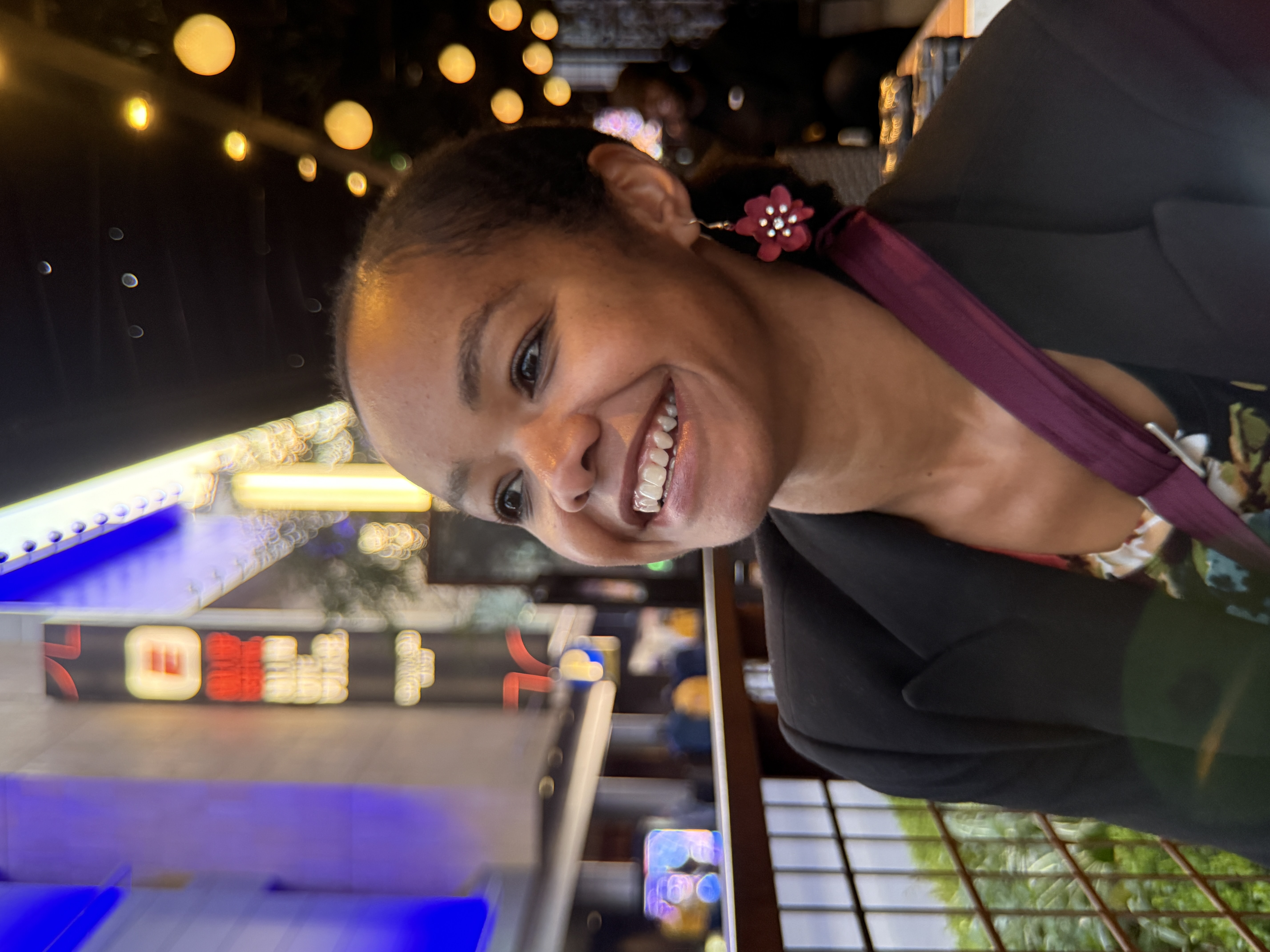 wife smiling as we wait for food