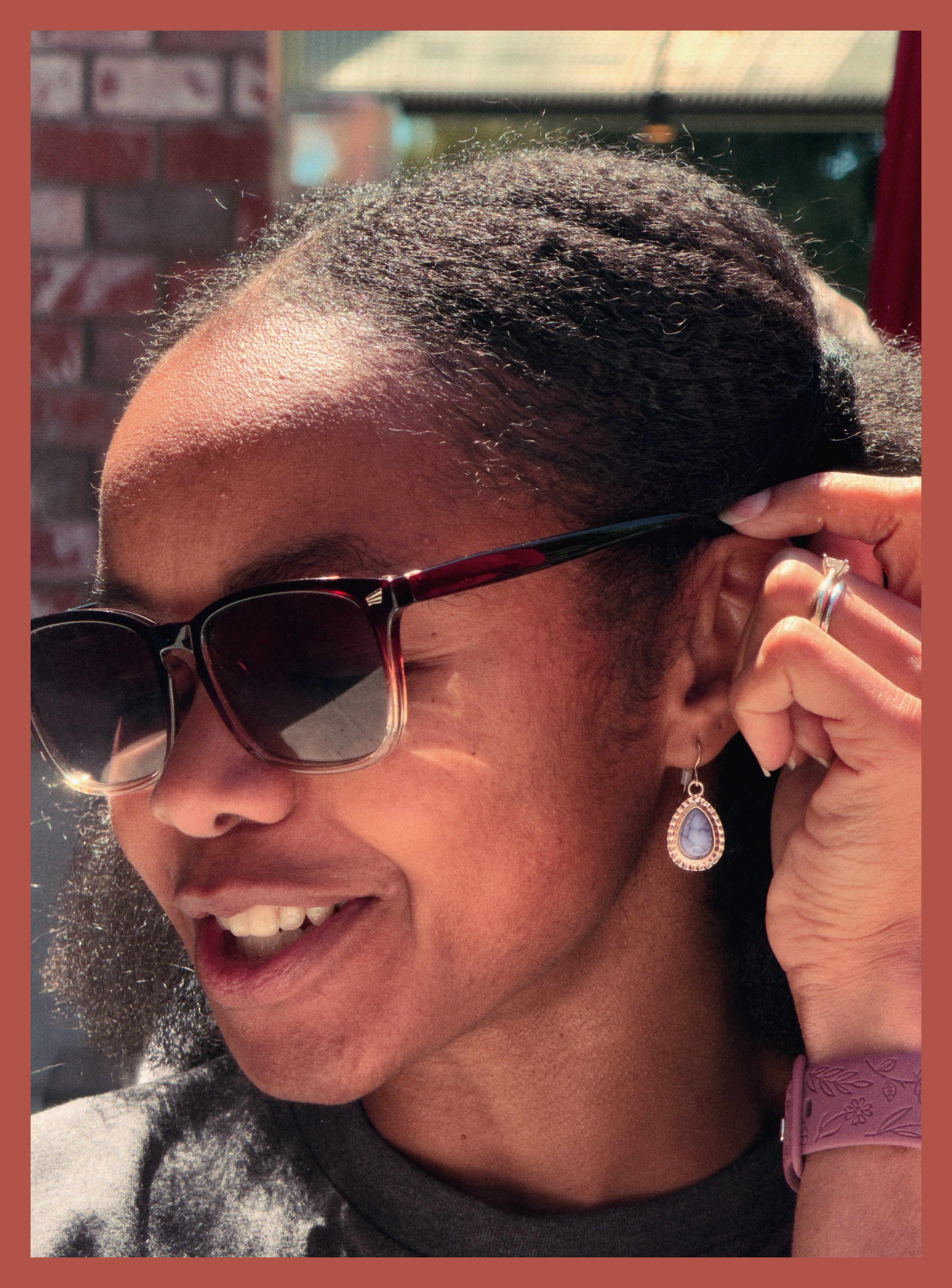 Lakeisha showing off her earrings