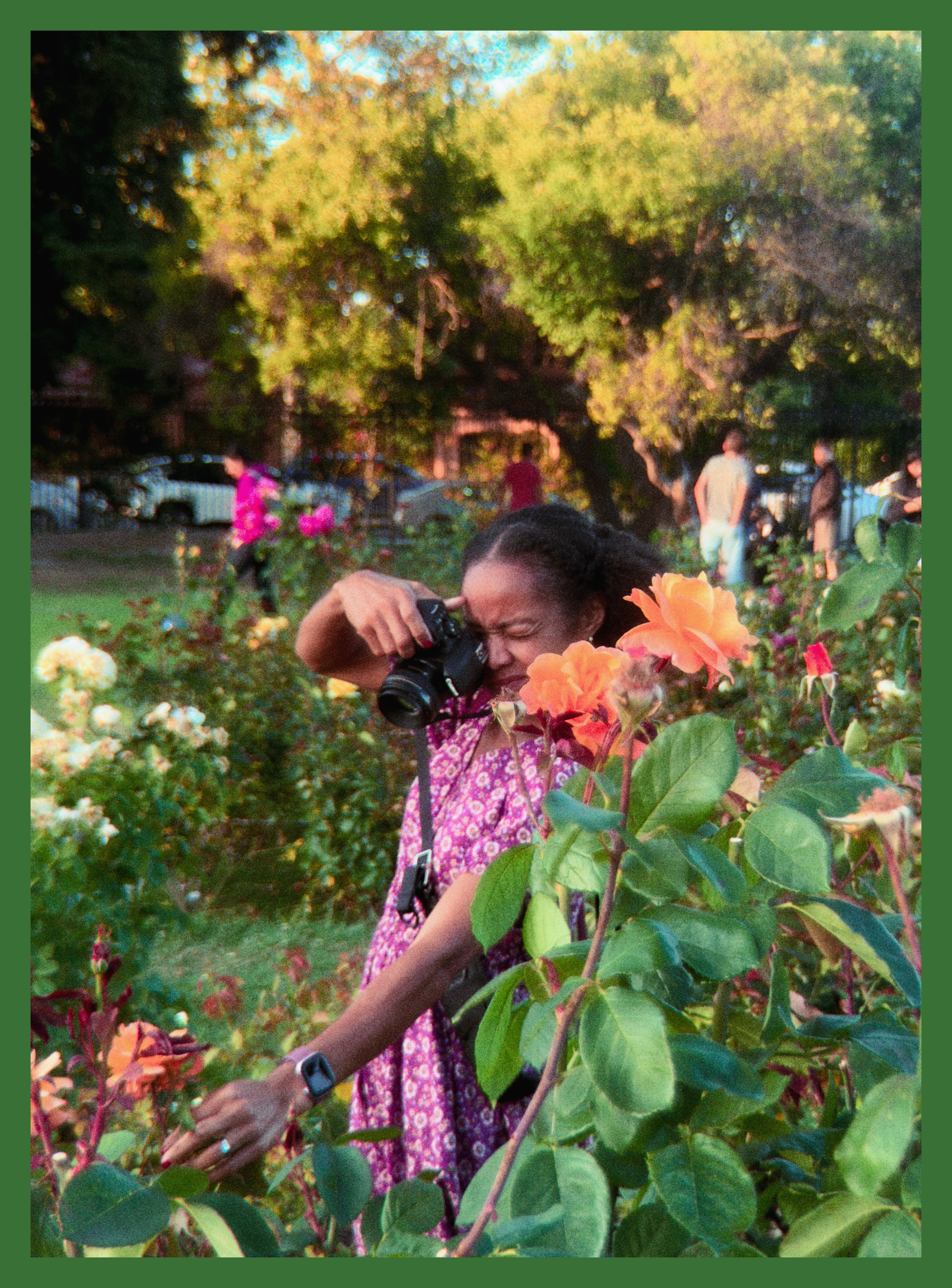 Lakeisha taking pictures of flowers