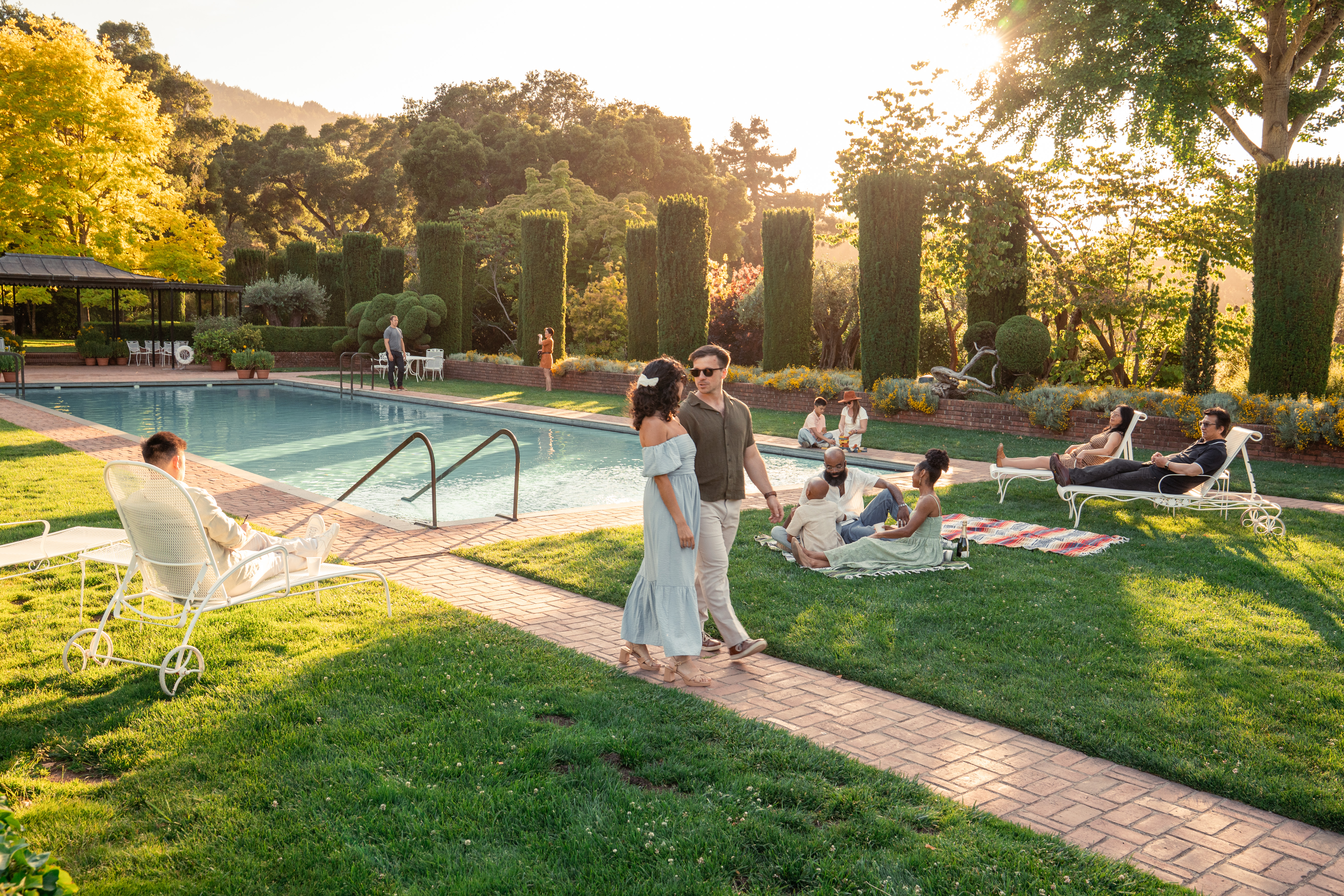 cast shot of everyone enjoying being by the pool